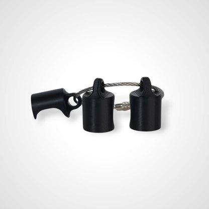 Three black polylactic acid created using additive manufacturing classic cap clips on steel cable keyring. Shown on a white background.