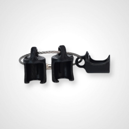 Three black polylactic acid created using additive manufacturing classic cap clips on steel cable keyring. Shown on a white background.