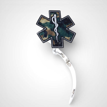 Camo Star badge reel. On a swivel-alligator clip that rotates 360° with a nylon retractable string. Shown on a white background.