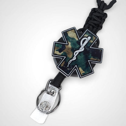 Camo Star badge reel. On a carabiner with a steel retractable cable. Shown on a white background.