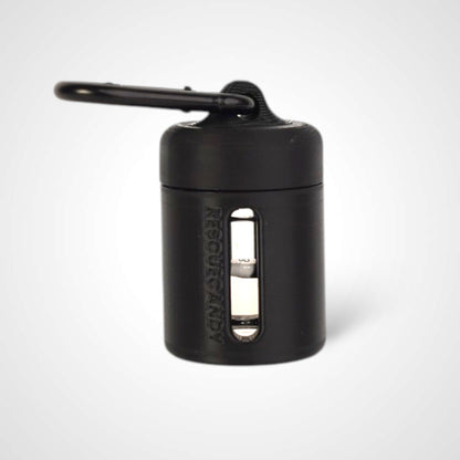 Black vial vault. For empty 2ml or smaller vials, made with polylactic acid created using additive manufacturing. With 1.37" stainless steel black coated carabiner. Shown with vial in it on white background.