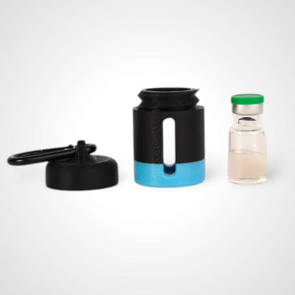 Black with blue stripe vial vault. For empty 2ml or smaller vials, made with polylactic acid created using additive manufacturing. With 1.37" stainless steel black coated carabiner. Shown next to vial on white background.