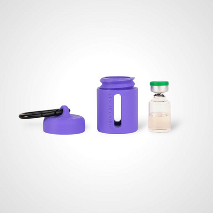Purple vial vault. For empty 2ml or smaller vials, made with polylactic acid created using additive manufacturing. With 1.37" stainless steel black coated carabiner. Shown next to vial on white background.