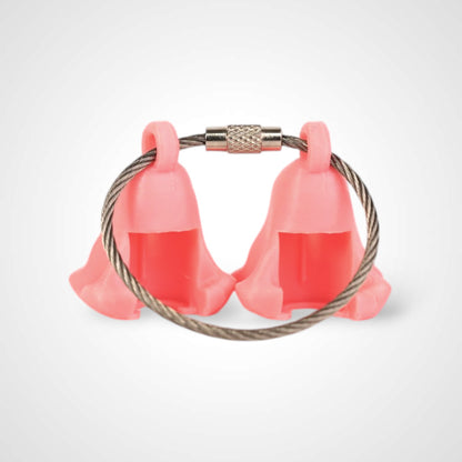 Two pink polylactic acid created using additive manufacturing ghost cap clips on steel cable keyring. Shown on a white background.
