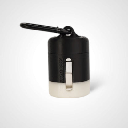 Black with white stripe vial vault. For empty 2ml or smaller vials, made with polylactic acid created using additive manufacturing. With 1.37" stainless steel black coated carabiner. Shown with vial in it on white background.