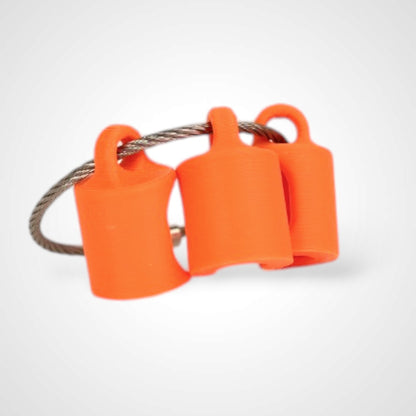 Three orange polylactic acid created using additive manufacturing classic cap clips on steel cable keyring. Shown on a white background.