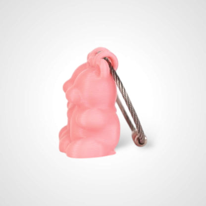 Two pink polylactic acid created using additive manufacturing gummy bear cap clips on steel cable keyring. Shown on a white background.