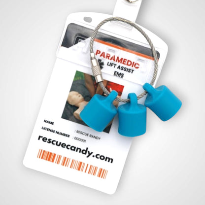 Blue polylactic acid created using additive manufacturing B-Braun cap clip on steel cable keyring. Featured attached to badge. Shown on white background.