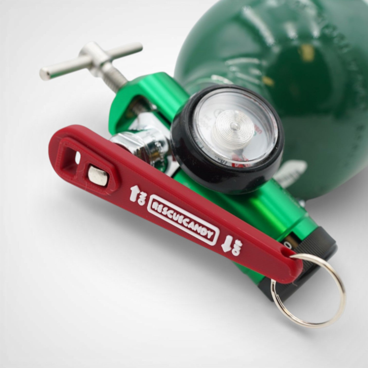 Full red Oxygen Wrench. Made to fit CGA-870 valves. Shown attached to oxygen bottle on white background.