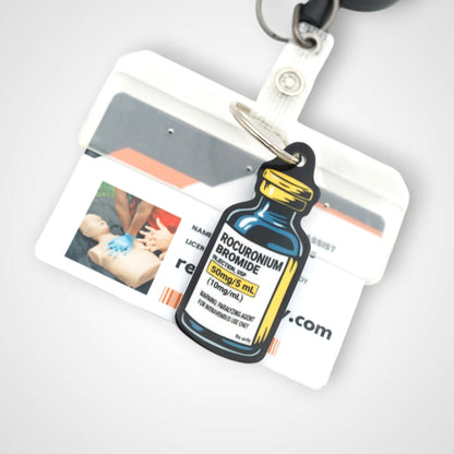 Rocuronium vial cast acrylic keychain with double coil keyring. Shown on badge.