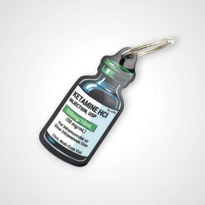 Ketamine vial cast acrylic keychain with double coil keyring. Shown on white background.