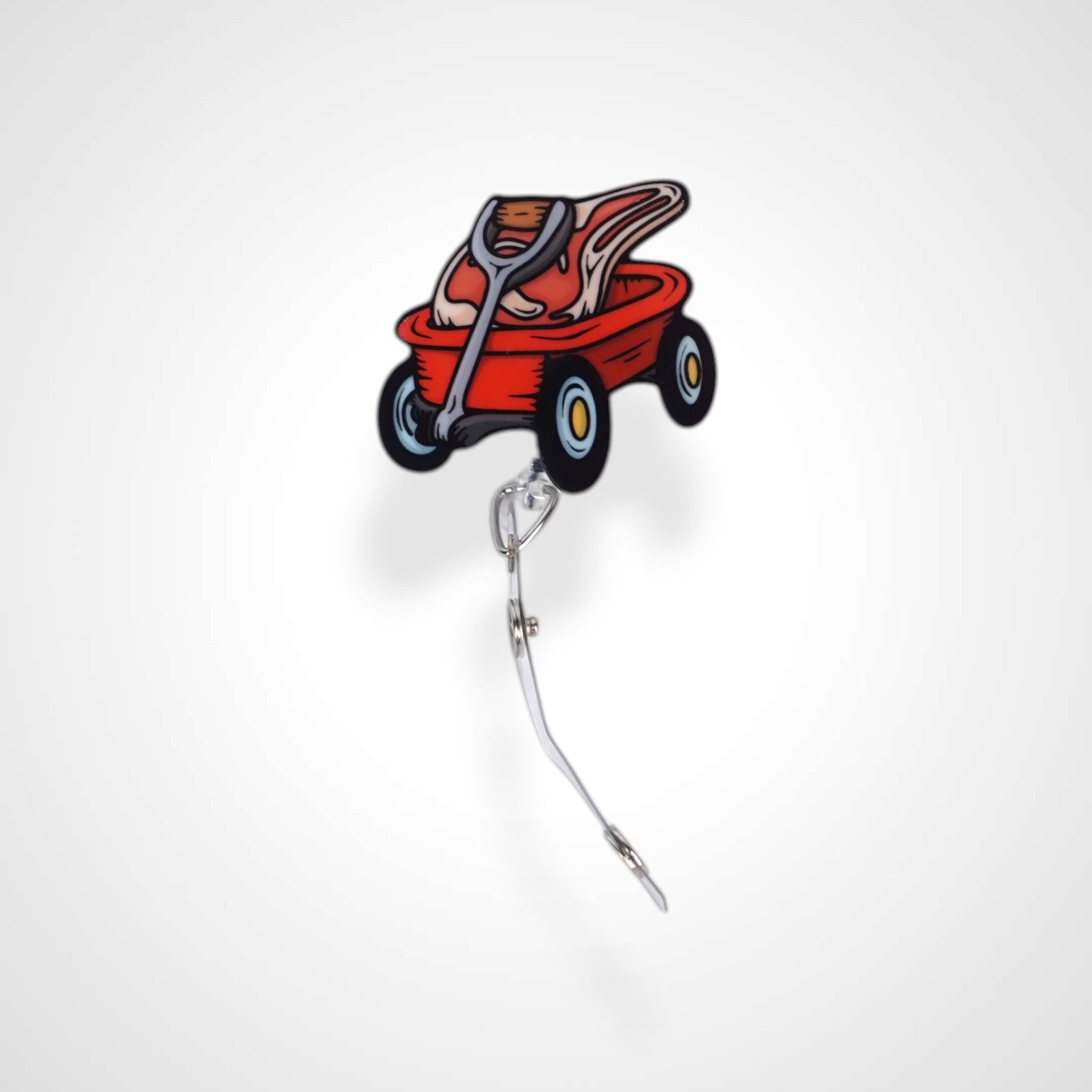 Meat wagon badge reel. On a swivel-alligator clip that rotates 360° with a nylon retractable string. Shown on a white background.
