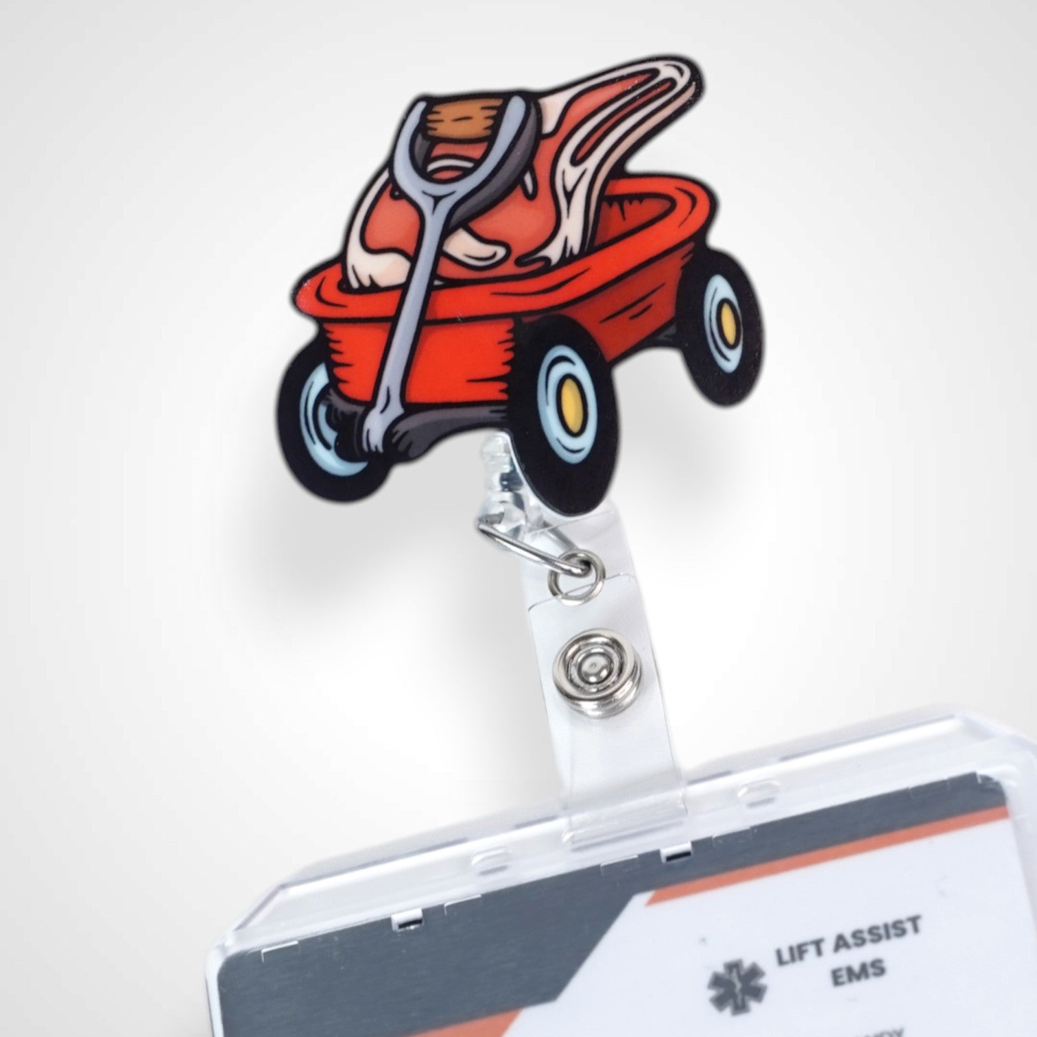 Meat wagon badge reel. On a swivel-alligator clip that rotates 360° with a nylon retractable string. Shown on a white background.
