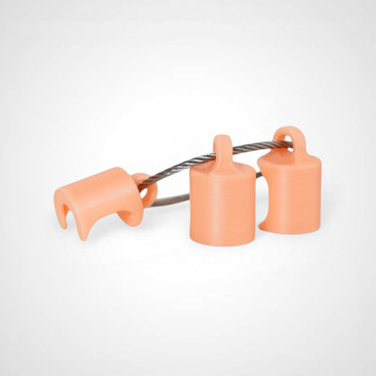 Three orange polylactic acid created using additive manufacturing classic cap clips on steel cable keyring. Shown on a white background.