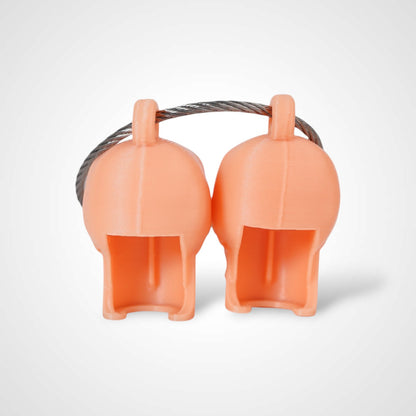 Two orange polylactic acid created using additive manufacturing skull cap clips on steel cable keyring. Shown on a white background.