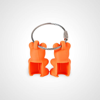 Two orange polylactic acid created using additive manufacturing gummy bear cap clips on steel cable keyring. Shown on a white background.