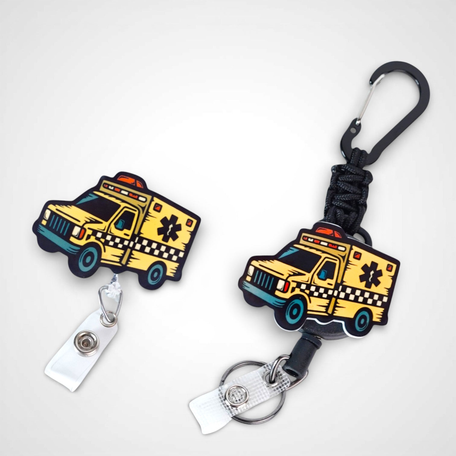 Taxi badge reel. On a carabiner with a steel retractable cable next to a swivel-alligator clip that rotates 360° with a nylon retractable string. Shown on a white background. 