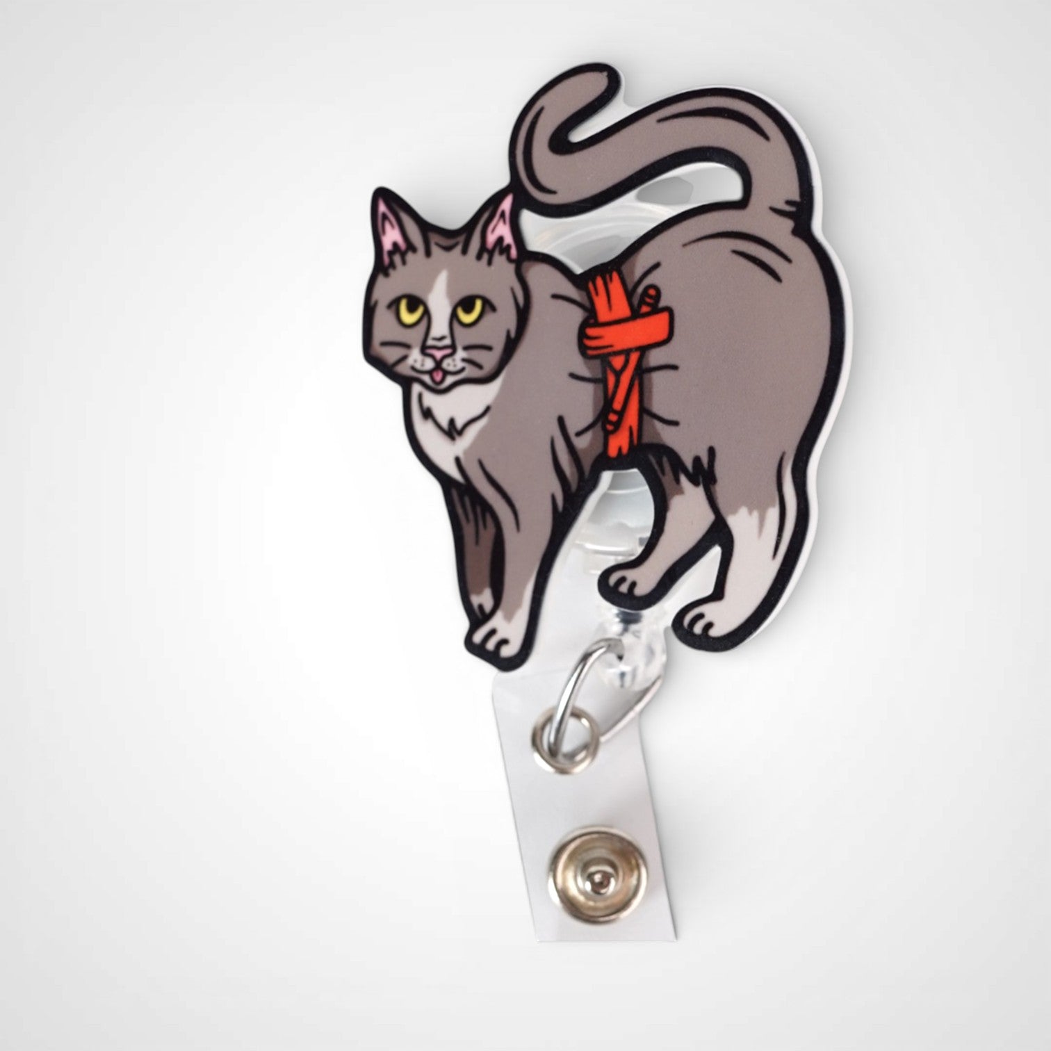 Tournicat badge reel. On a swivel-alligator clip that rotates 360° with a nylon retractable string. Shown on a white background.