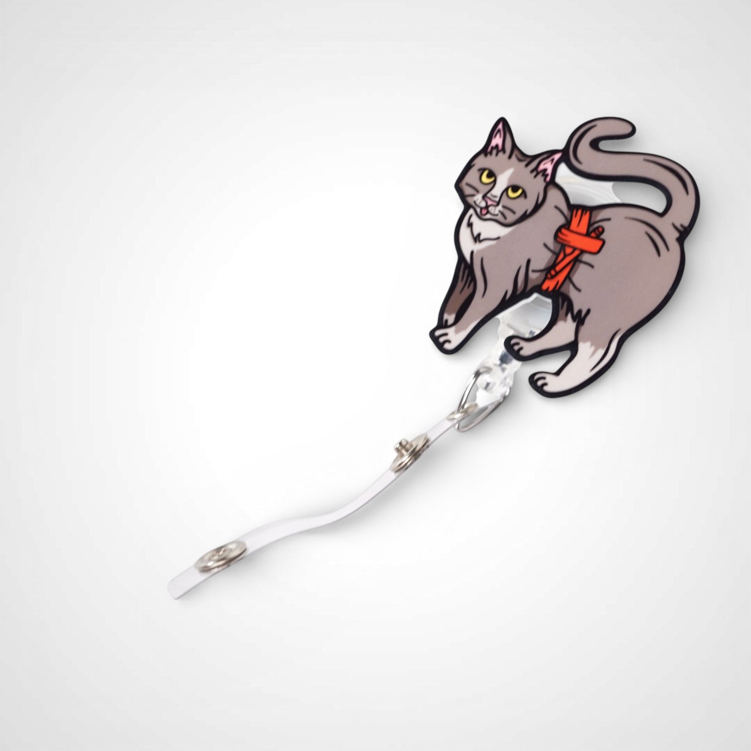Tournicat badge reel. On a swivel-alligator clip that rotates 360° with a nylon retractable string. Shown on a white background.