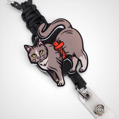 Tournicat badge reel. On a carabiner with a steel retractable cable. Shown on a white background.