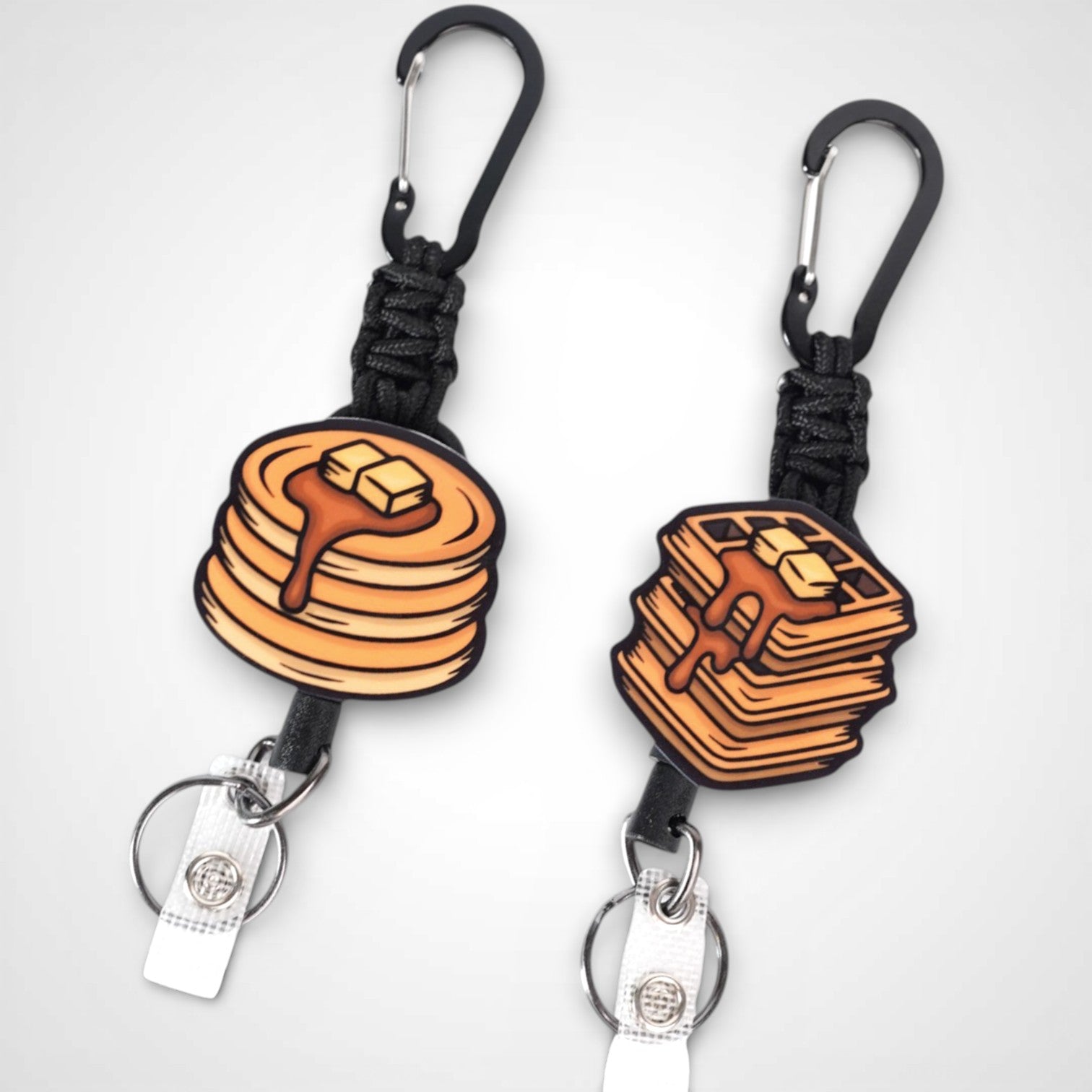 Pancake and waffle badge reel. On a carabiner with a steel retractable cable. Shown on a white background.