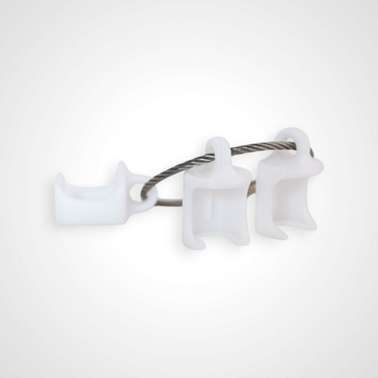 Three white polylactic acid created using additive manufacturing classic cap clips on steel cable keyring. Shown on a white background.