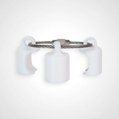 Three white polylactic acid created using additive manufacturing classic cap clips on steel cable keyring. Shown on a white background.