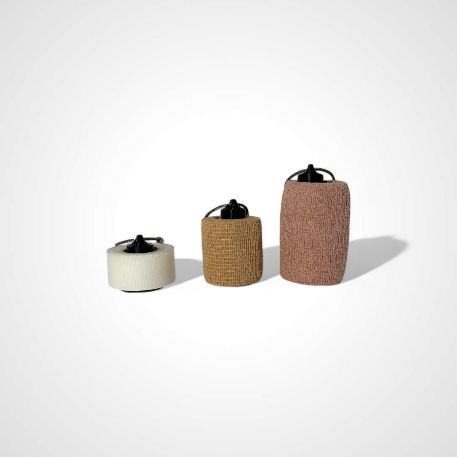 a compact black roll holder to hold and tape and coban for EMS, paramedics, EMT's, nurses, flightmed, vetmed, and athletic trainers