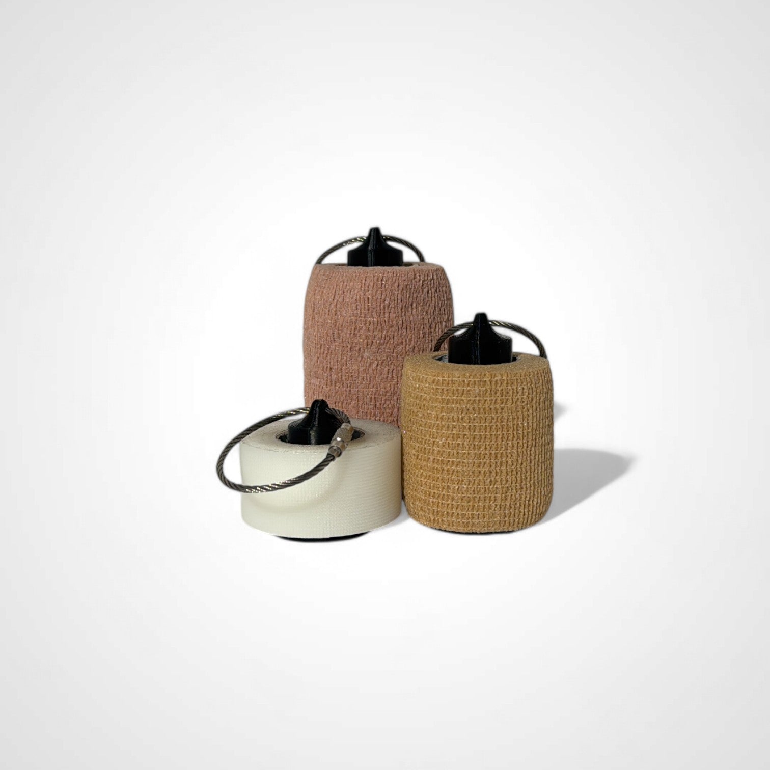 a compact black roll holder to hold and tape and coban for EMS, paramedics, EMT's, nurses, flightmed, vetmed, and athletic trainers
