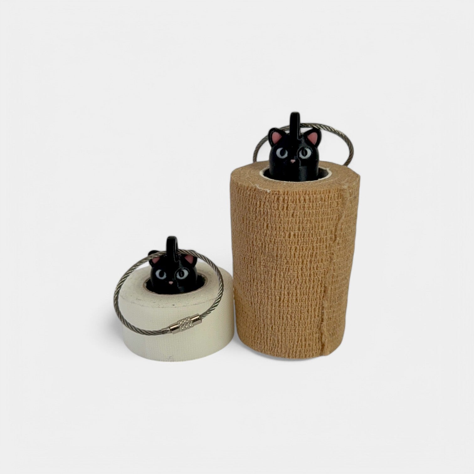 a compact black cat roll holder to hold and tape and coban for EMS, paramedics, EMT's, nurses, flightmed, vetmed, and athletic trainers