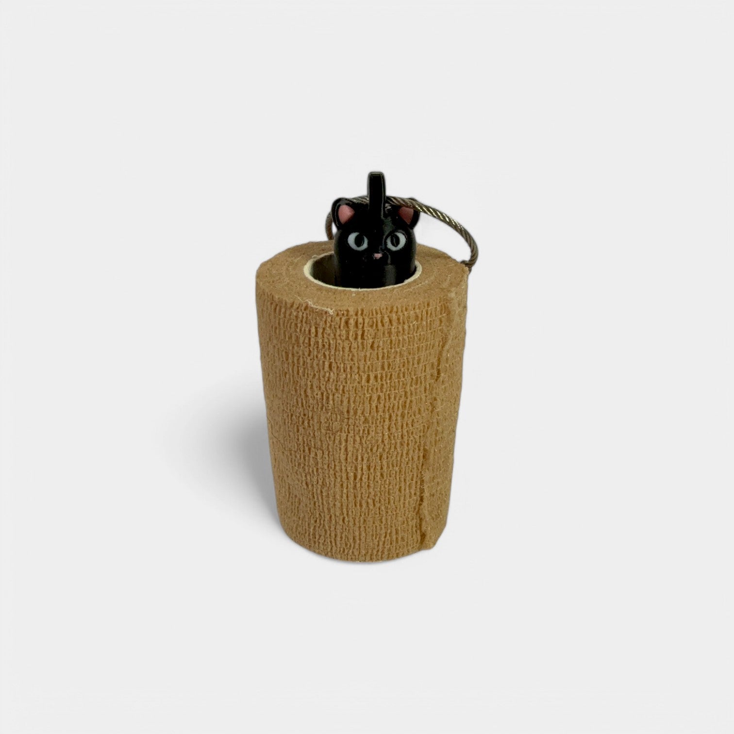 a compact black cat roll holder 3 inches tall to hold and tape and coban for EMS, paramedics, EMT's, nurses, flightmed, vetmed, and athletic trainers