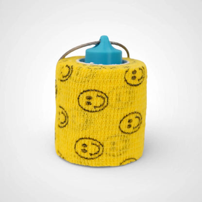 a compact utility keychain called a blue roll holder 2 inches tall to hold and tape transpore tape cohesive bandage coban and bangade rolls for EMS, paramedics, EMT's, nurses, flightmed, vetmed, and athletic trainers