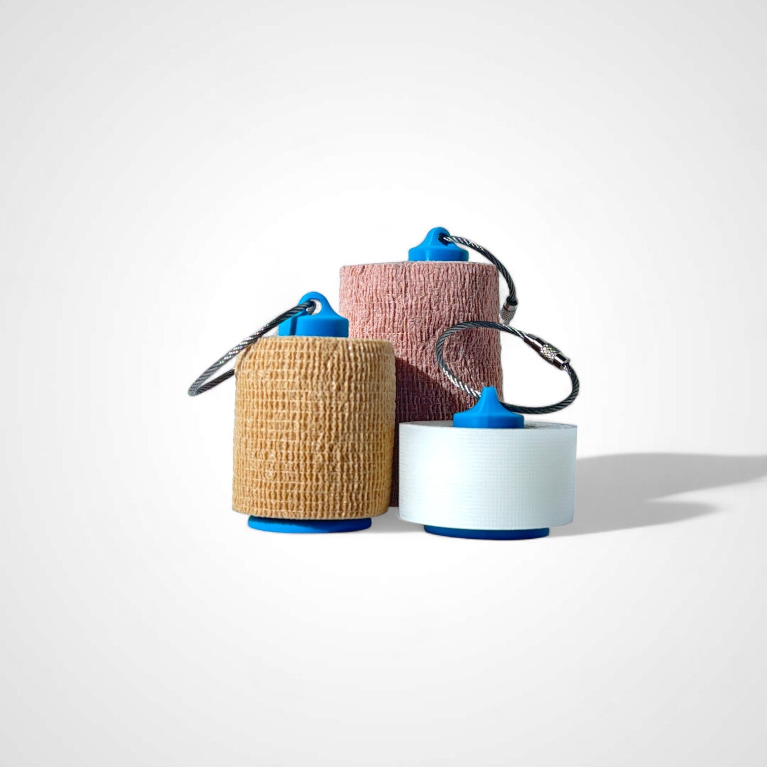 a compact blue roll holder to hold and tape and coban for EMS, paramedics, EMT's, nurses, flightmed, vetmed, and athletic trainers