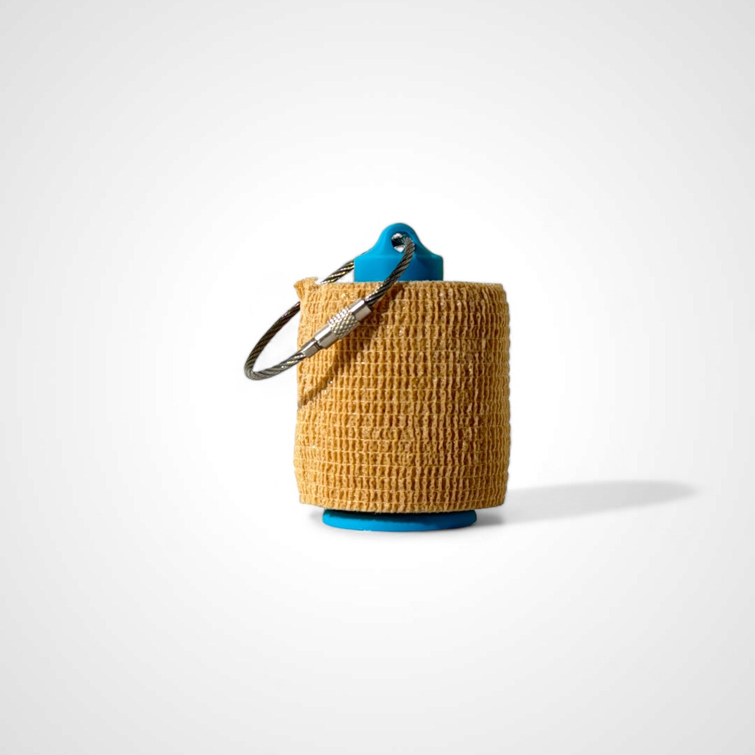 a compact blue roll holder 2 inches tall to hold and tape and coban for EMS, paramedics, EMT's, nurses, flightmed, vetmed, and athletic trainers