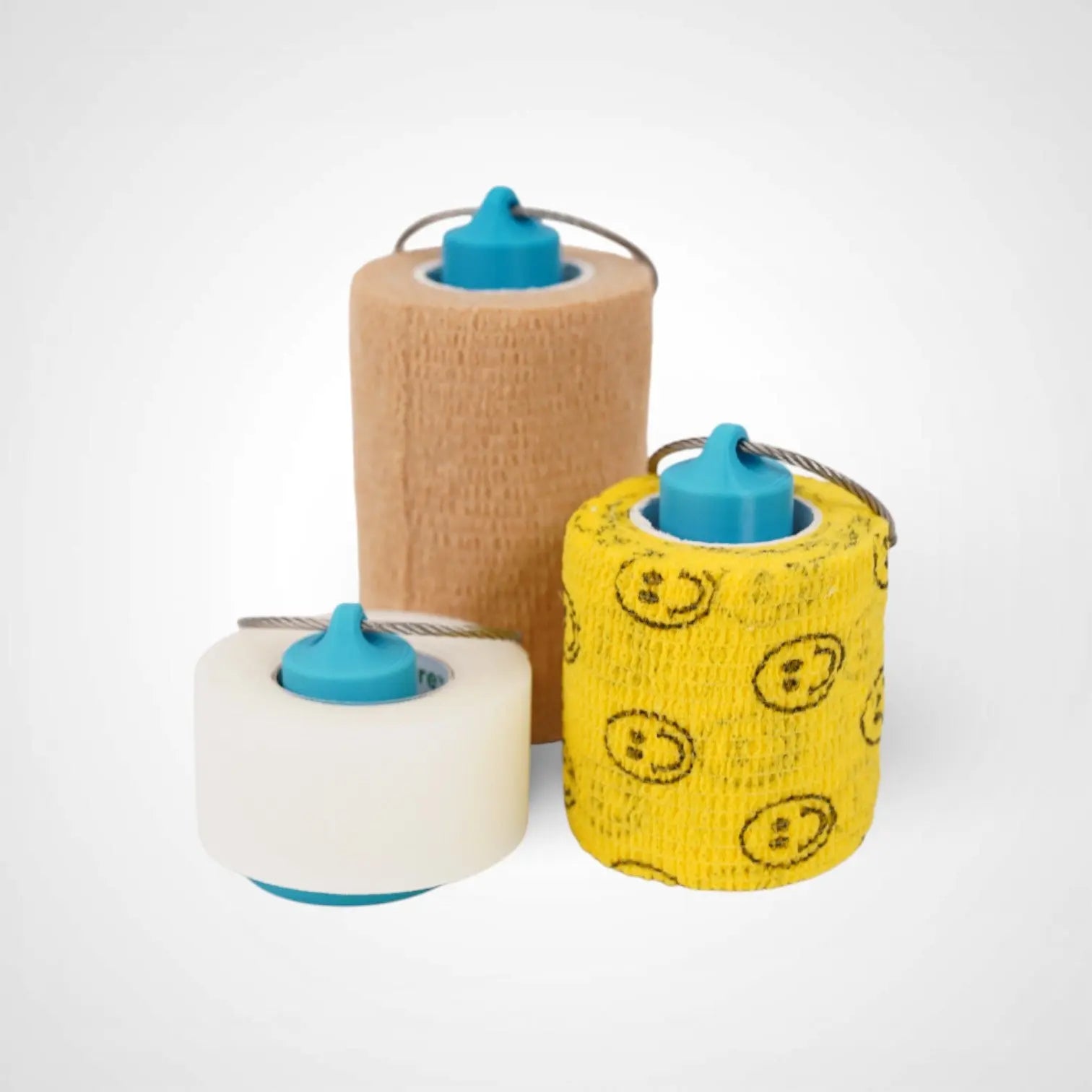 a compact utility keychain called a blue roll holder 3 inches tall, 2 inches tall, 1 inches tall to hold and tape transpore tape cohesive bandage coban and bangade rolls for EMS, paramedics, EMT's, nurses, flightmed, vetmed, and athletic trainers