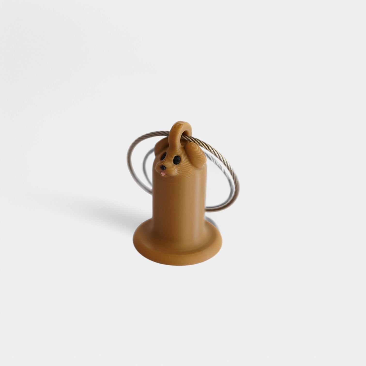 a compact brown dog roll holder 1 inch tall to hold and tape and coban for EMS, paramedics, EMT's, nurses, flightmed, vetmed, and athletic trainers