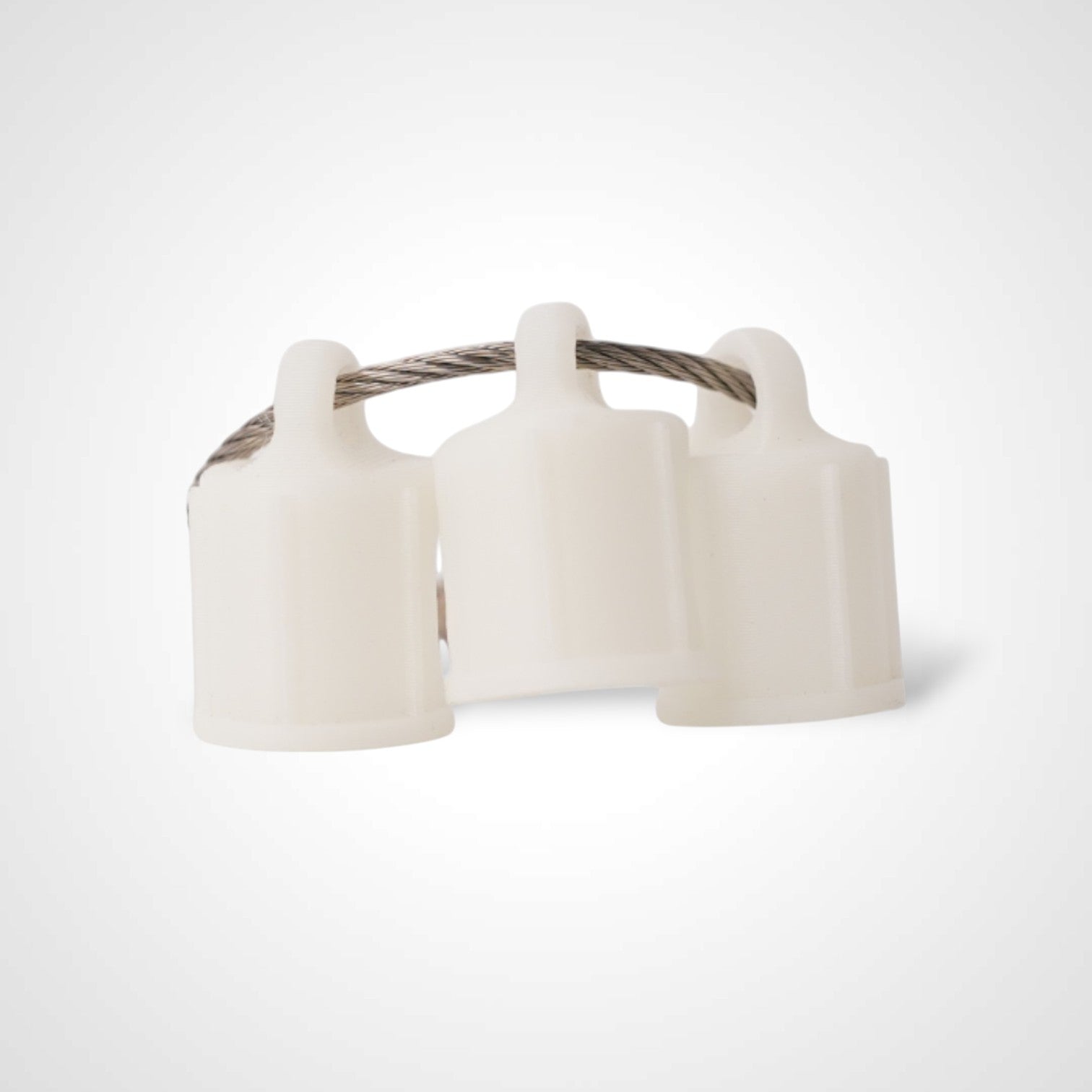 Three white polylactic acid created using additive manufacturing faux flush cap clips on steel cable keyring. Shown on a white background.
