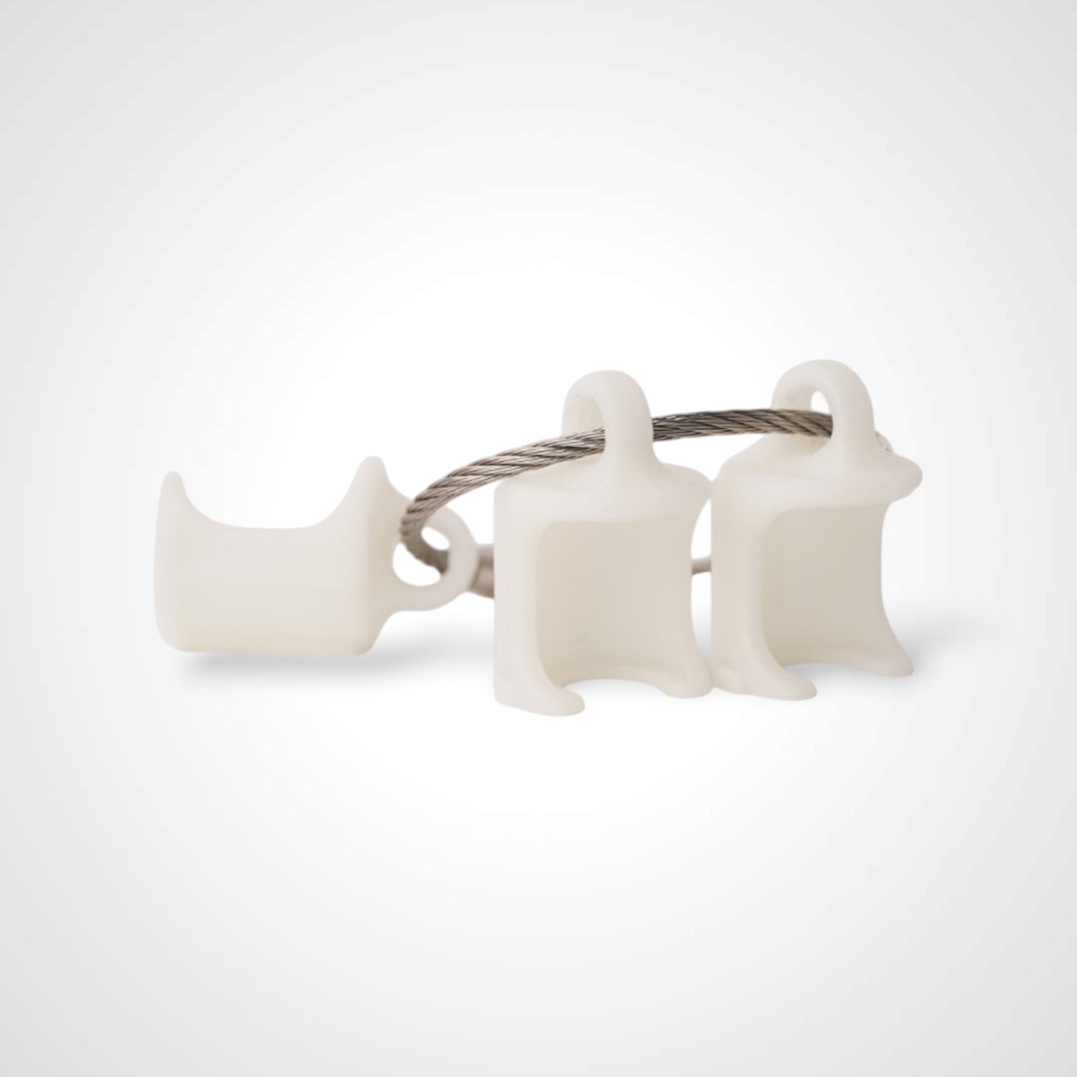 Three white polylactic acid created using additive manufacturing faux flush cap clips on steel cable keyring. Shown on a white background.