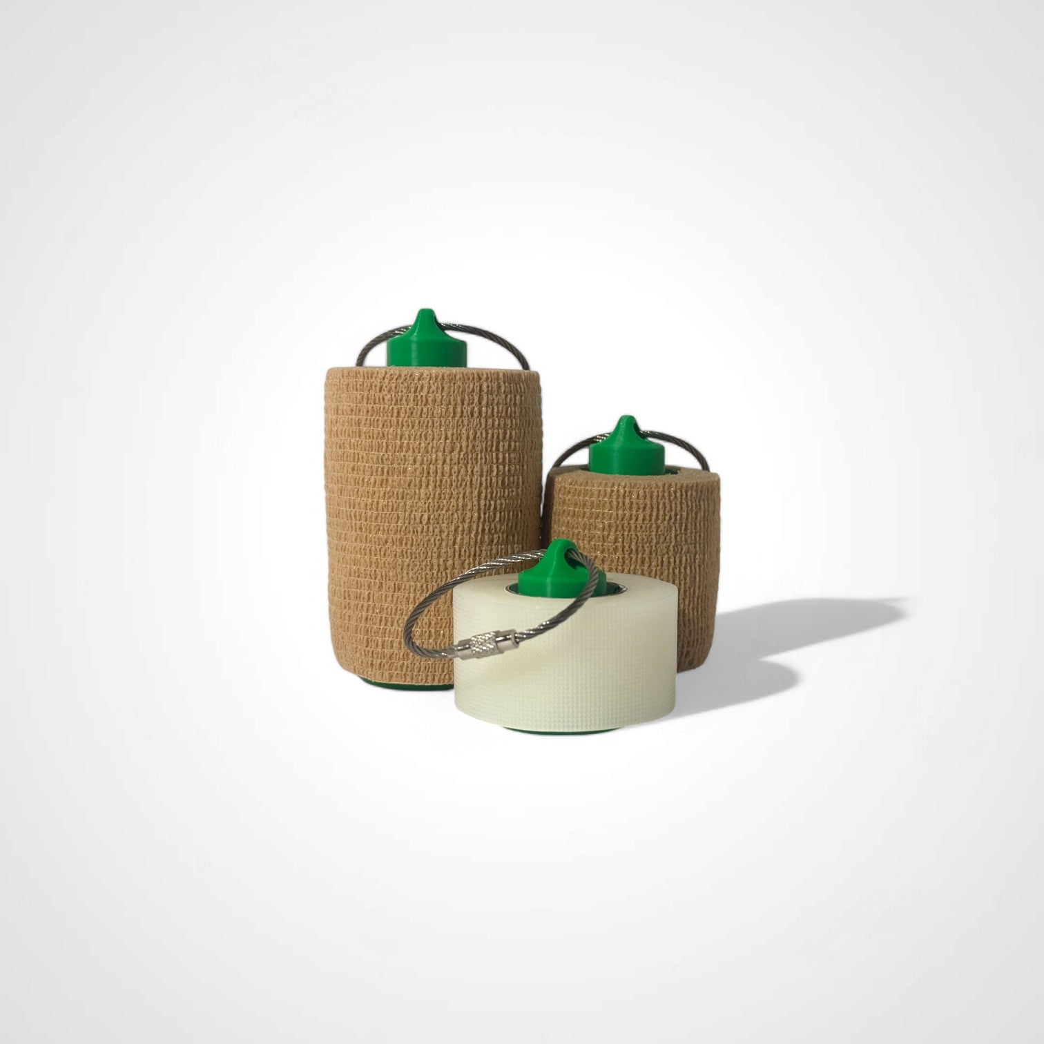 a compact green roll holder to hold and tape and coban for EMS, paramedics, EMT's, nurses, flightmed, vetmed, and athletic trainers