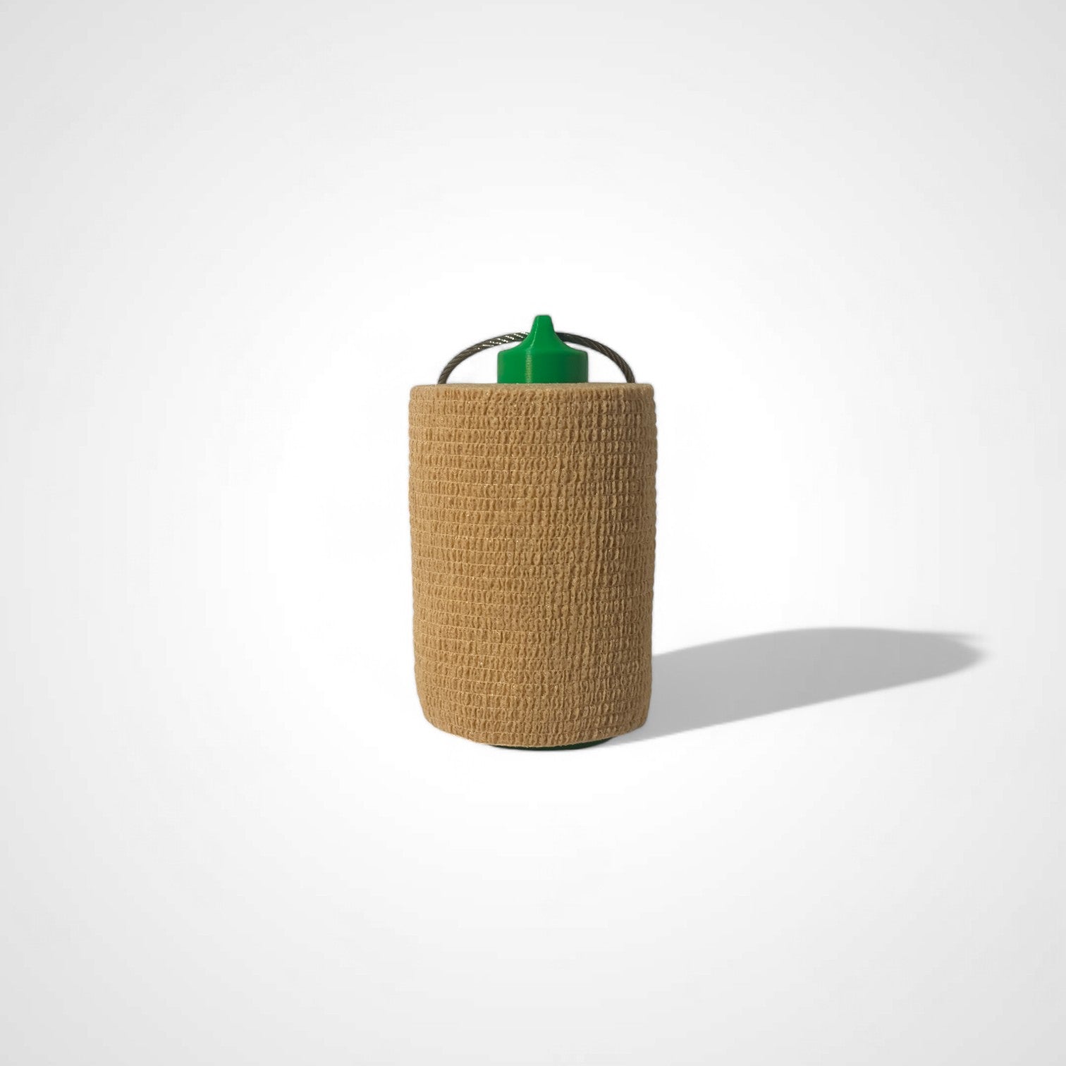 a compact green roll holder 3 inches tall to hold and tape and coban for EMS, paramedics, EMT's, nurses, flightmed, vetmed, and athletic trainers
