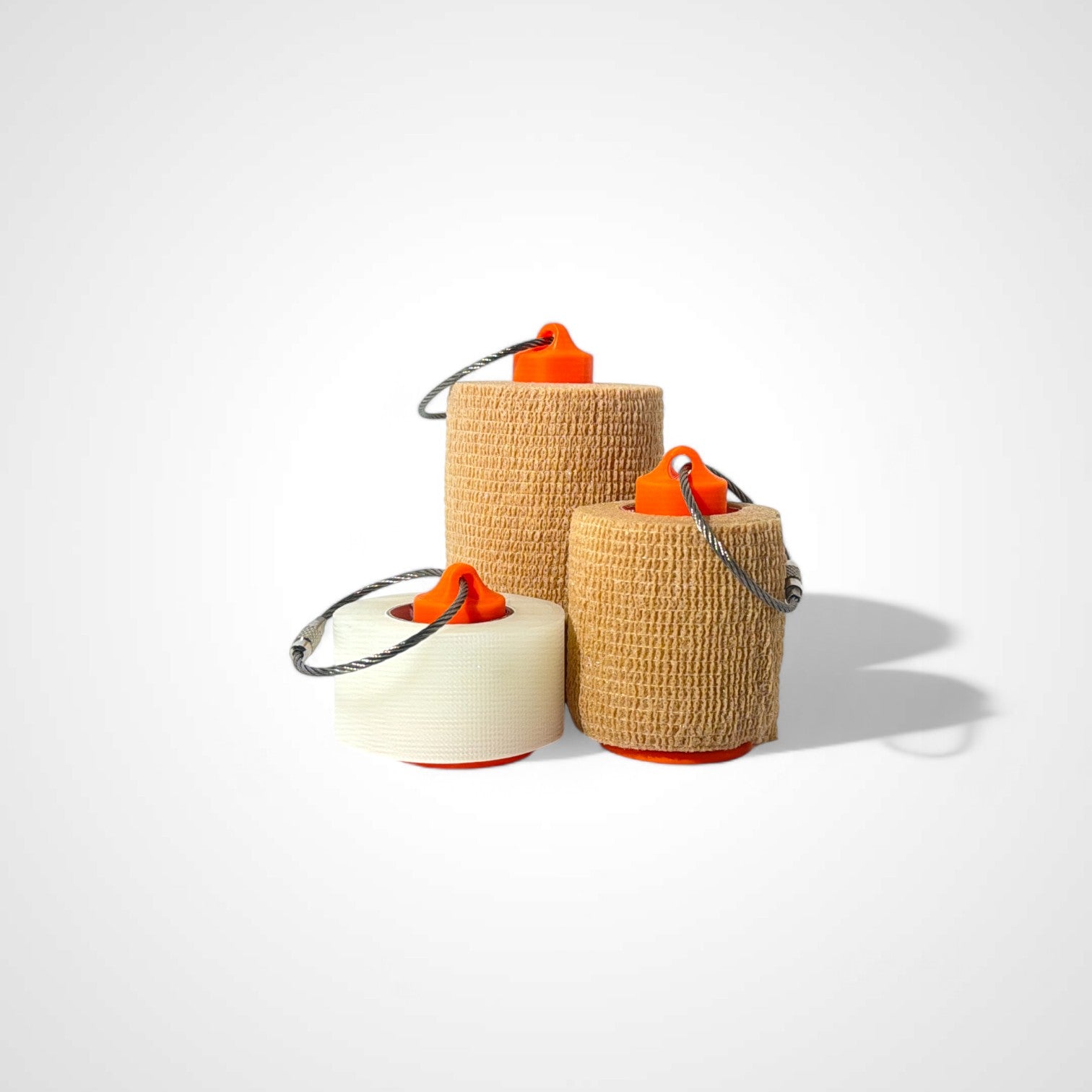 a compact orange roll holder to hold and tape and coban for EMS, paramedics, EMT's, nurses, flightmed, vetmed, and athletic trainers