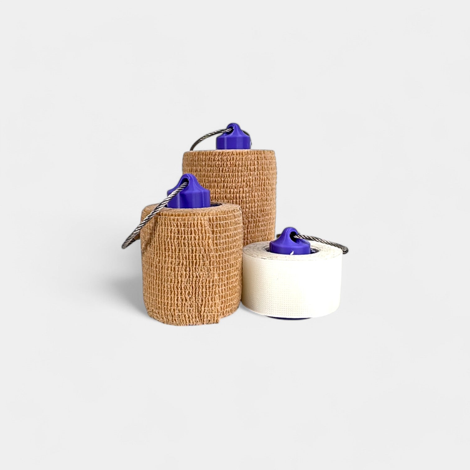 a compact purple roll holder to hold and tape and coban for EMS, paramedics, EMT's, nurses, flightmed, vetmed, and athletic trainers