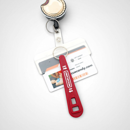 Full red Oxygen Wrench. Made to fit CGA-870 valves. Shown attached to badge on white background.