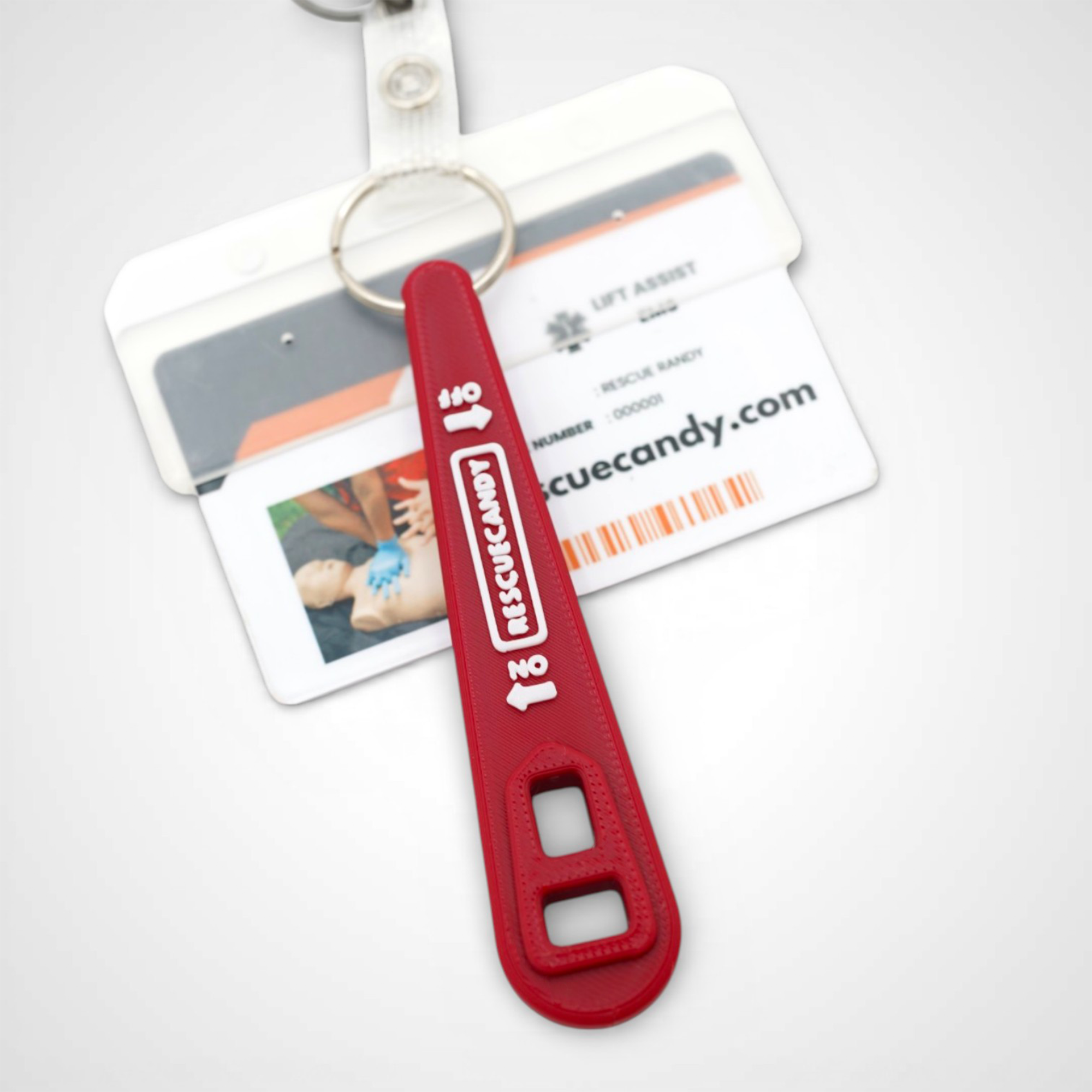Full red Oxygen Wrench. Made to fit CGA-870 valves. Shown attached to badge on white background.