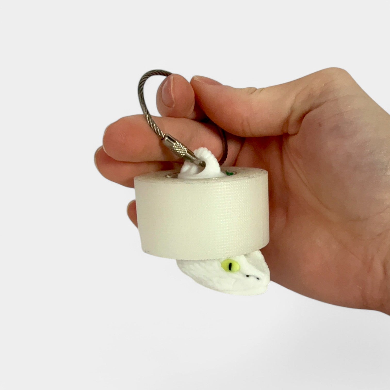 a compact white snake roll holder to hold and tape and coban for EMS, paramedics, EMT's, nurses, flightmed, vetmed, and athletic trainers