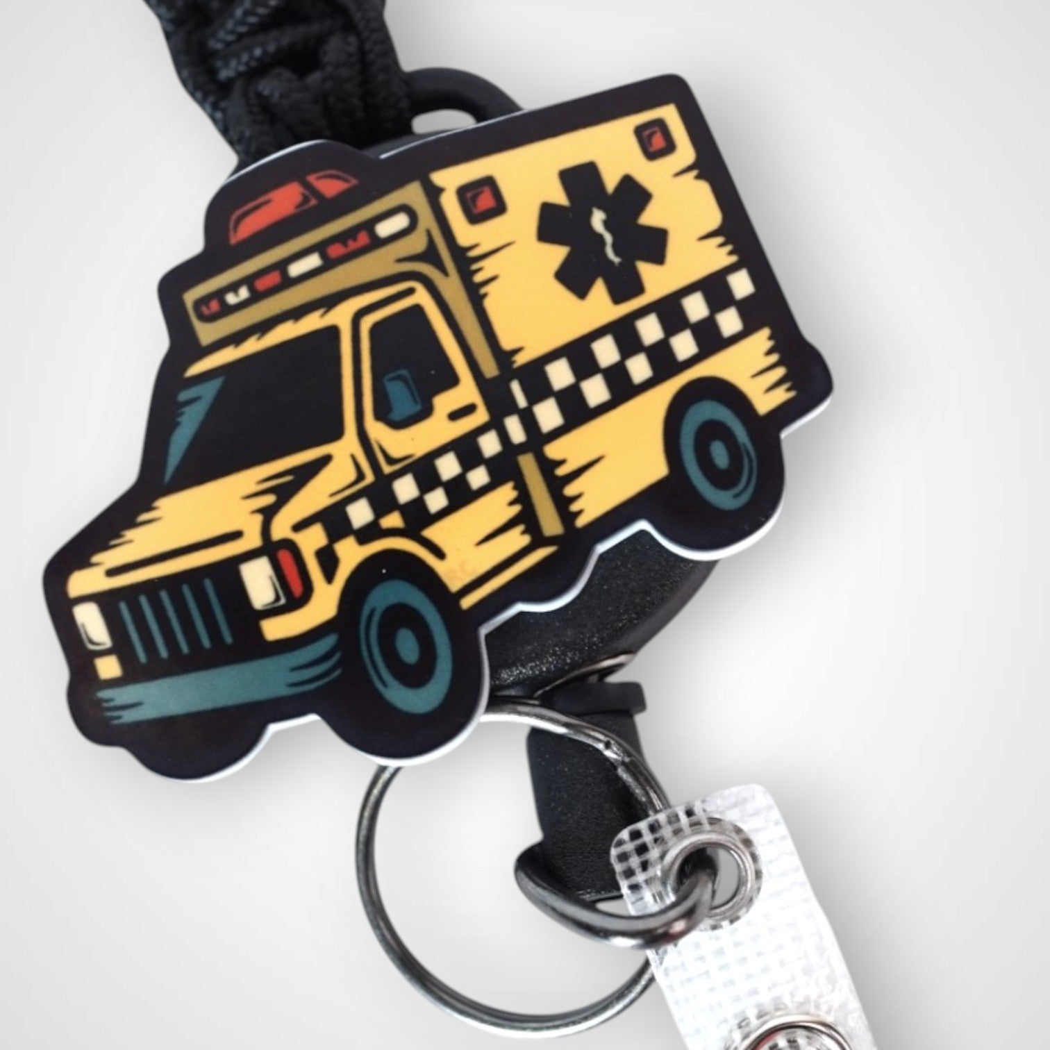 Taxi badge reel. On a carabiner with a steel retractable cable. Shown on a white background.
