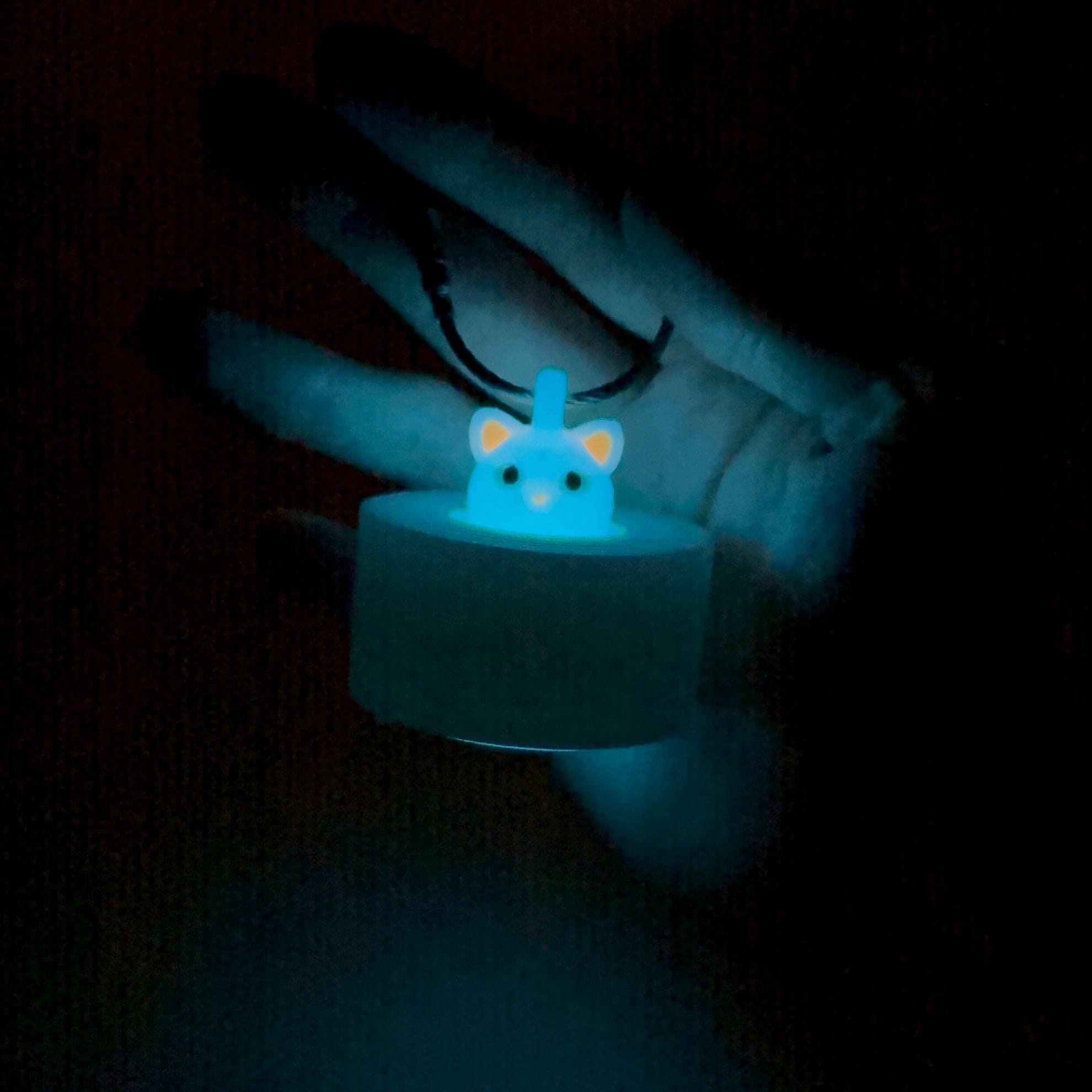 a compact white glow cat roll holder to hold and tape and coban for EMS, paramedics, EMT's, nurses, flightmed, vetmed, and athletic trainers